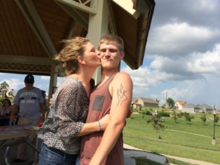 mom kissing son