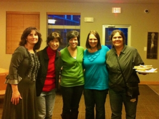 five women posing together